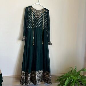 Indian party wear Bottle green in color.